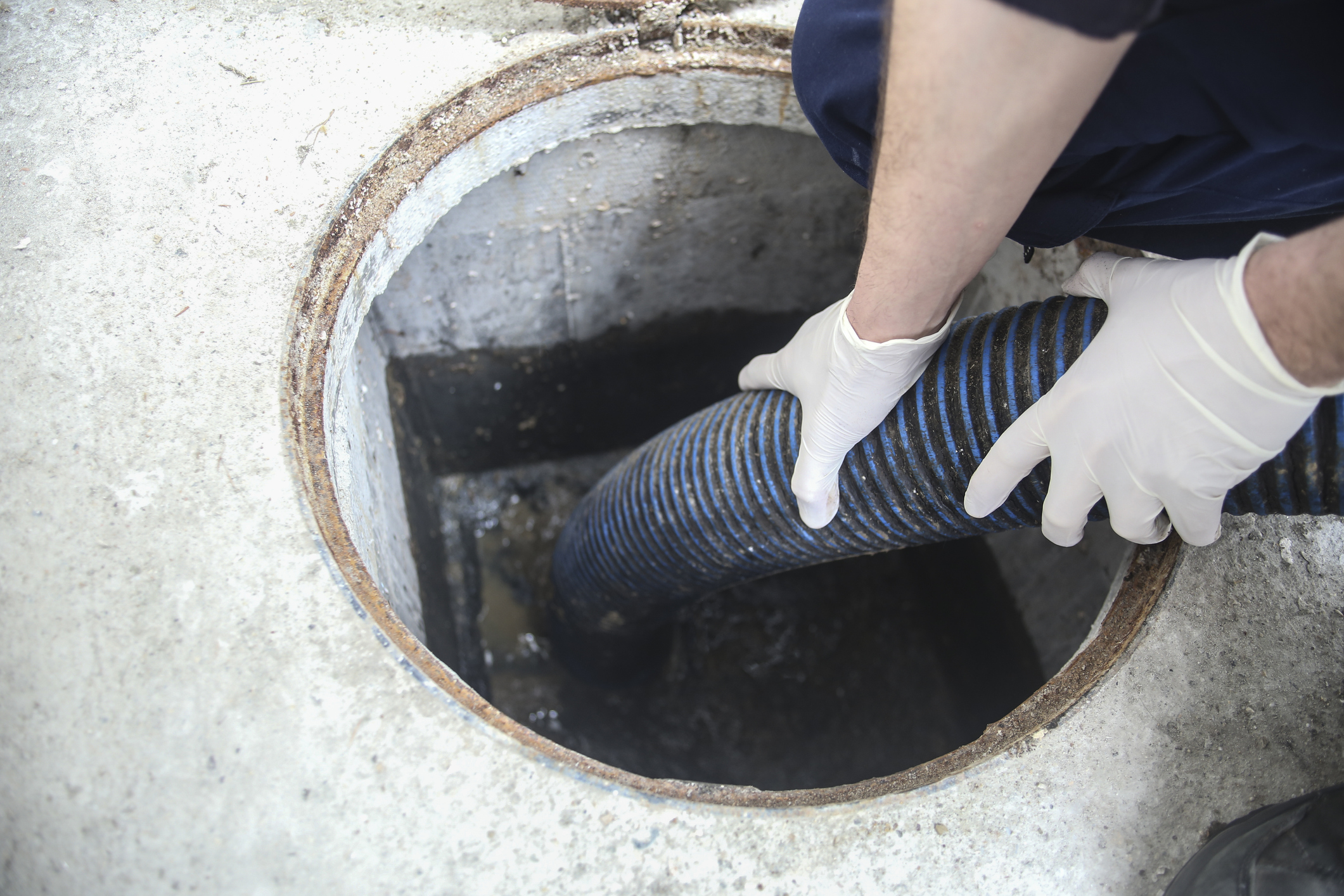 Worker cleaning the sewage system